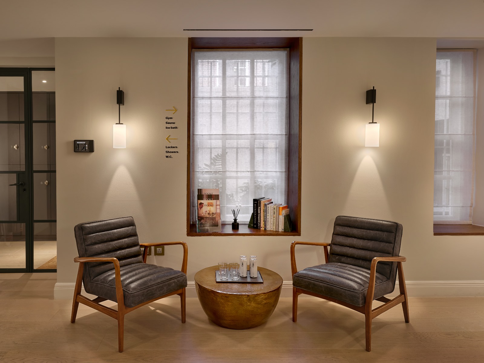 Swiss Touch clinic lounge with elegant leather chairs and warm ambient lighting