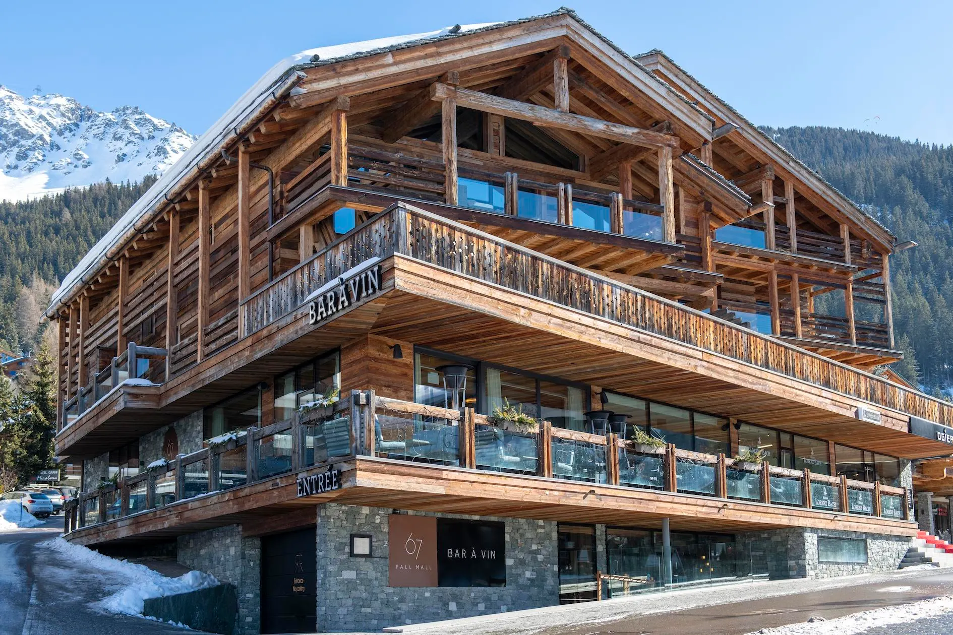 The 67 Pall Mall wine bar chalet in Verbier, set against snow-covered mountains
